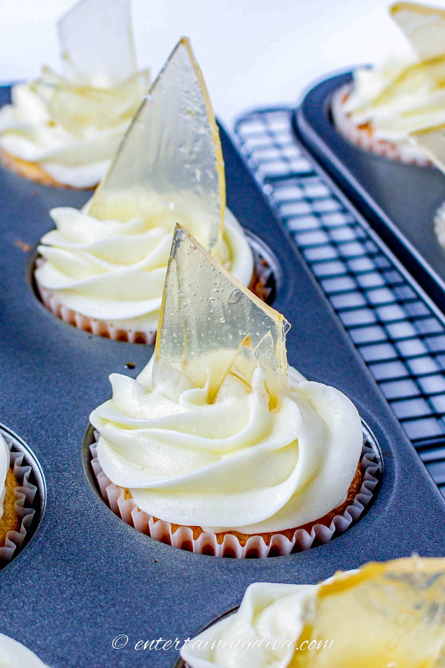 Cupcakes with white frosting and broken candy glass