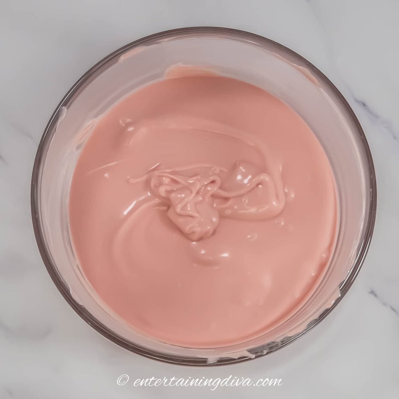 melted pink candy melts in a bowl
