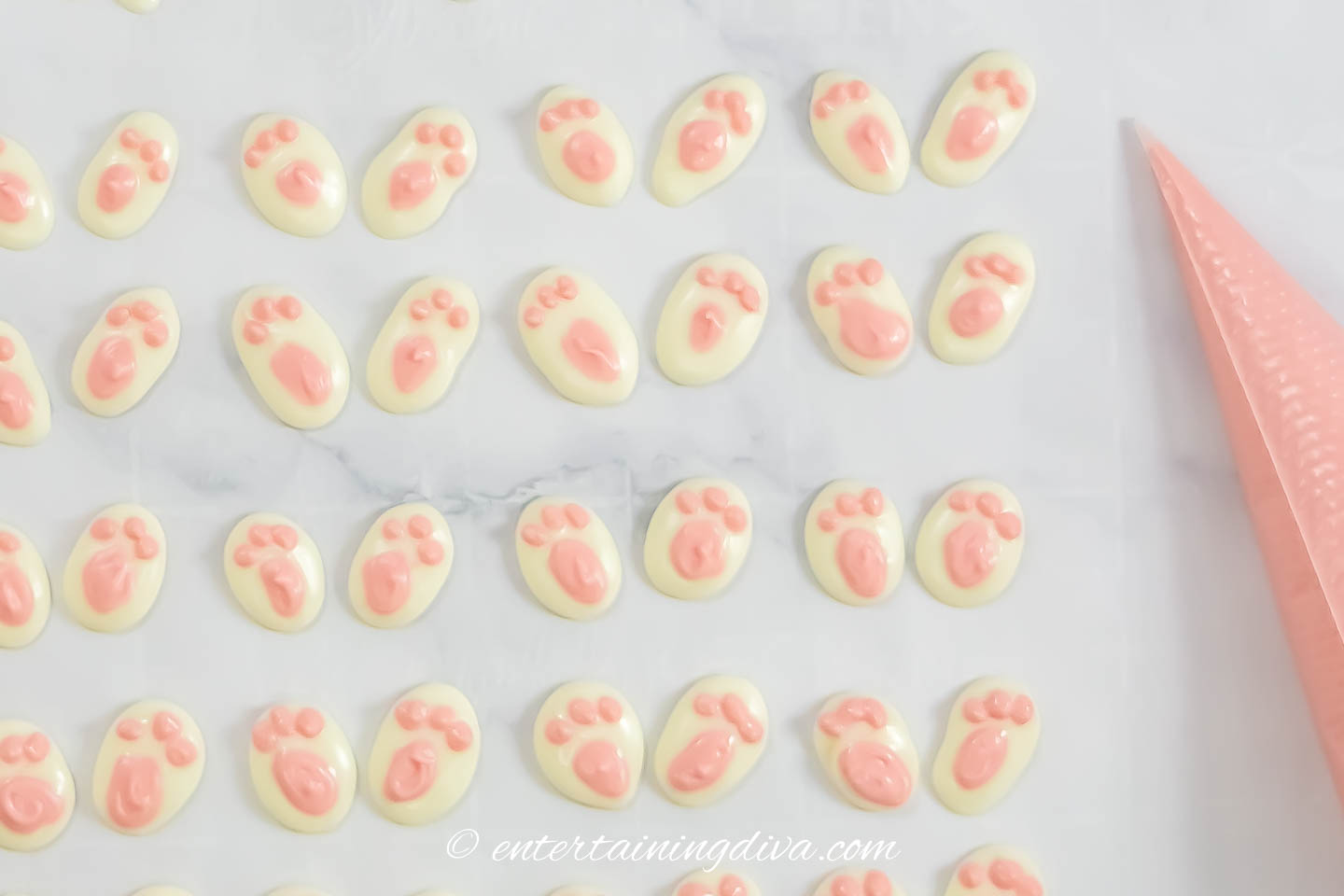 white chocolate bunny feet with pink paw prints
