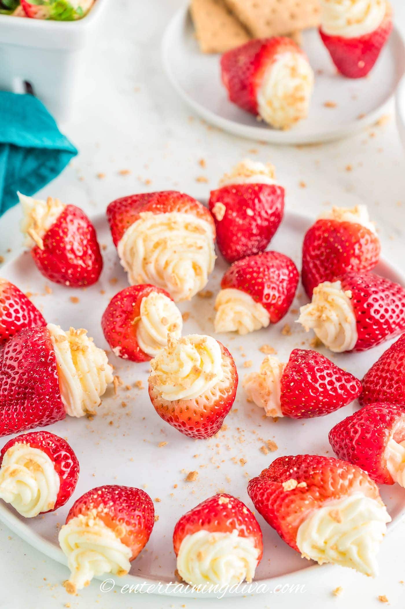 cheesecake filled strawberries on a plate