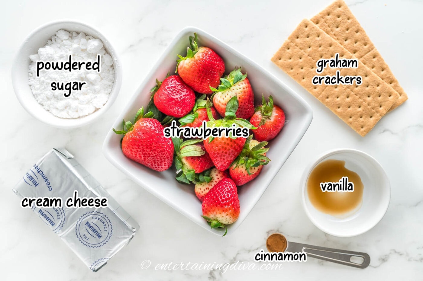 cheesecake stuffed strawberries ingredients - strawberries, cream cheese, powdered sugar, graham crackers, vanilla and cinnamon