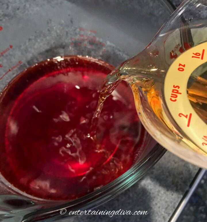 fireball being poured into cherry jello