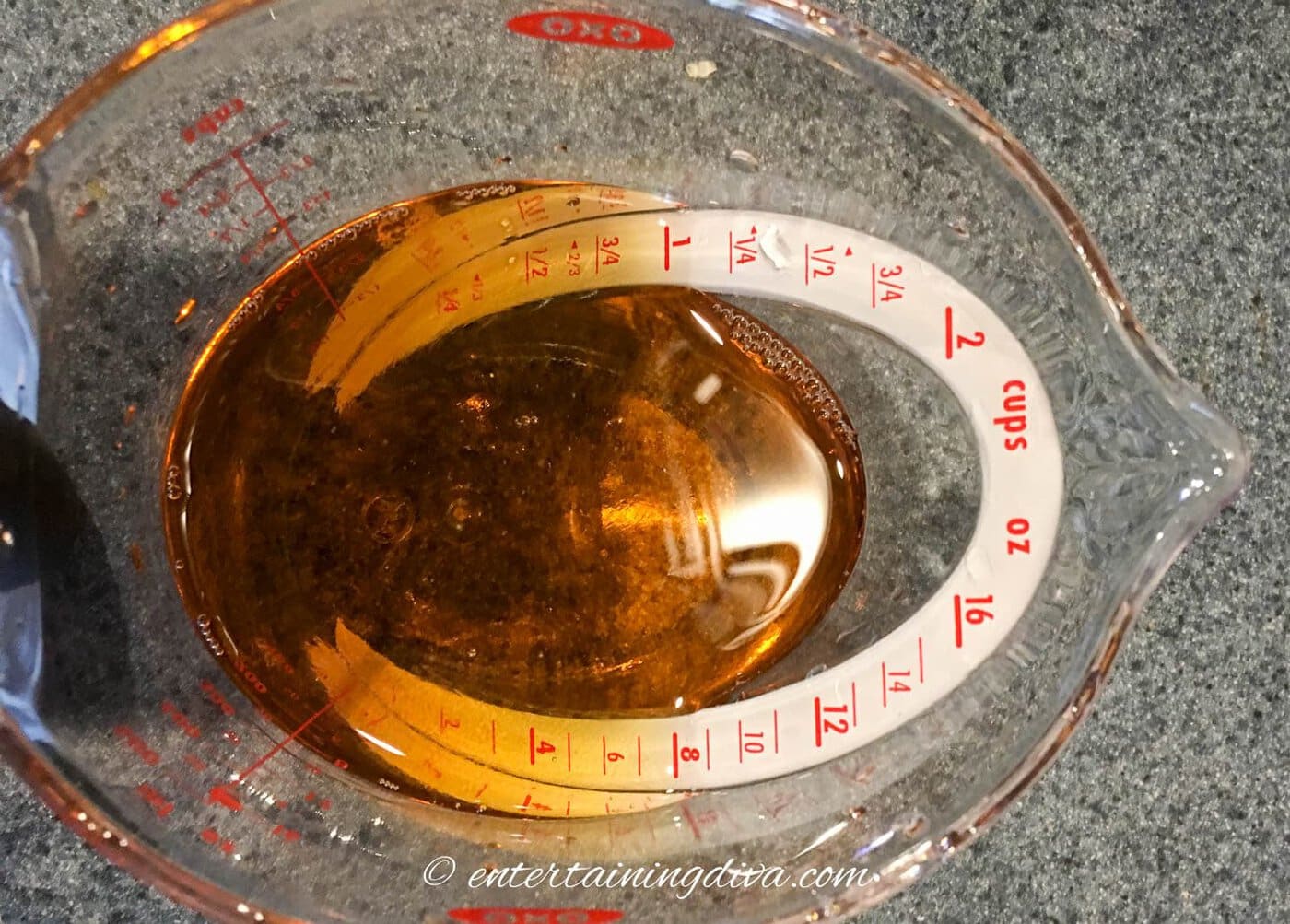 fireball whiskey and water in a measuring cup