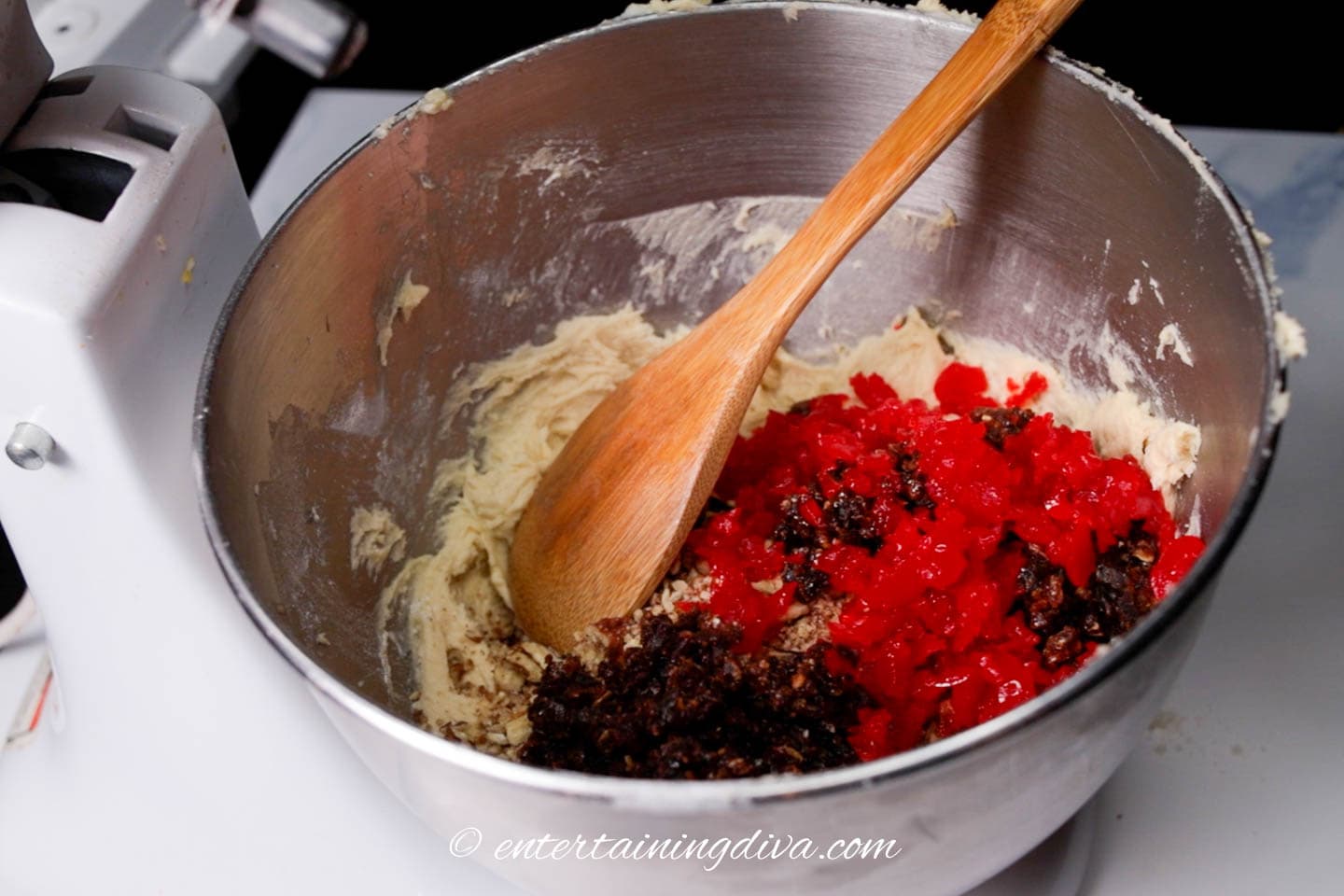 stirring in the chopped nuts and fruit