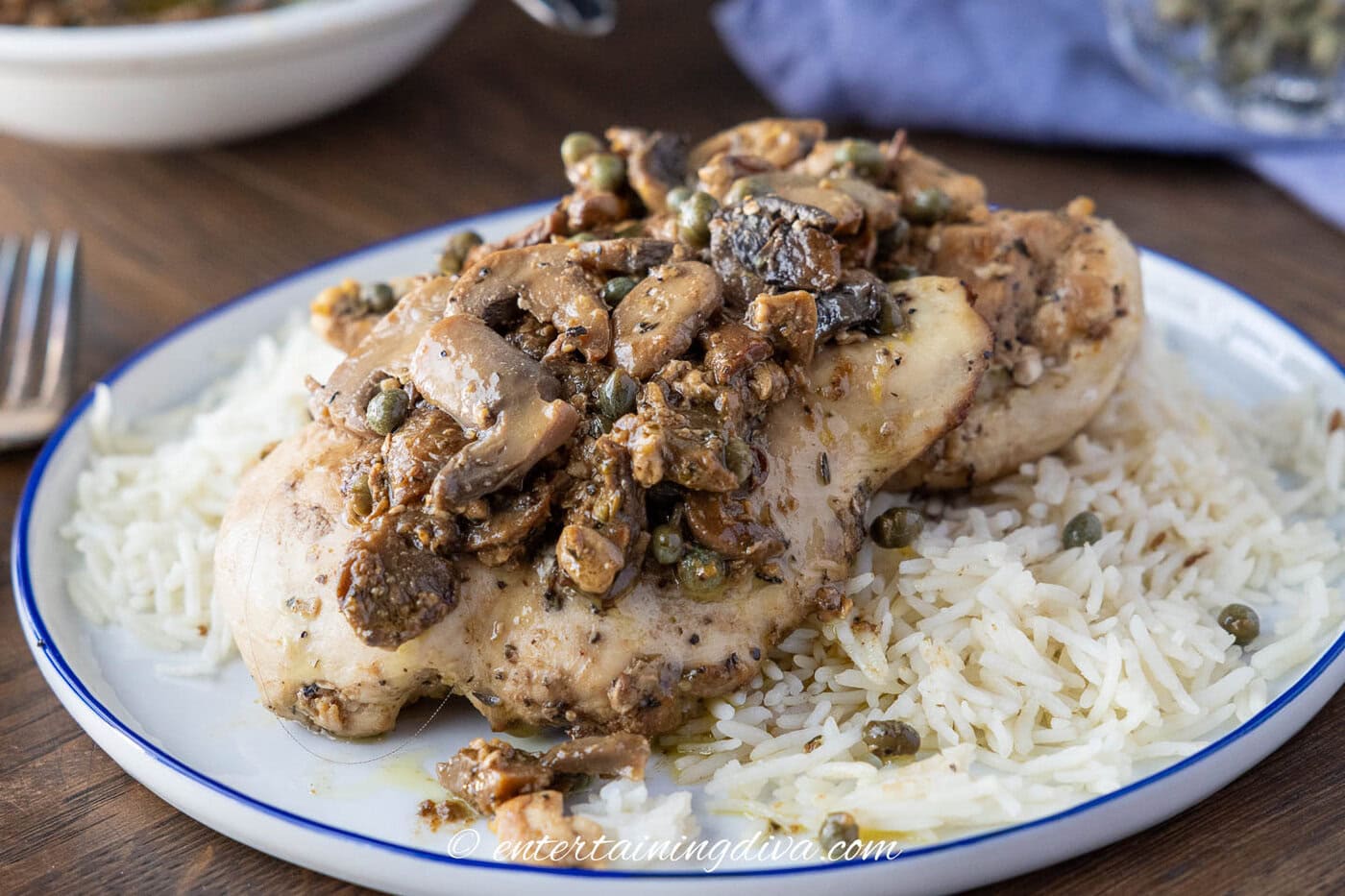 Chicken piccata with mushrooms on a plate
