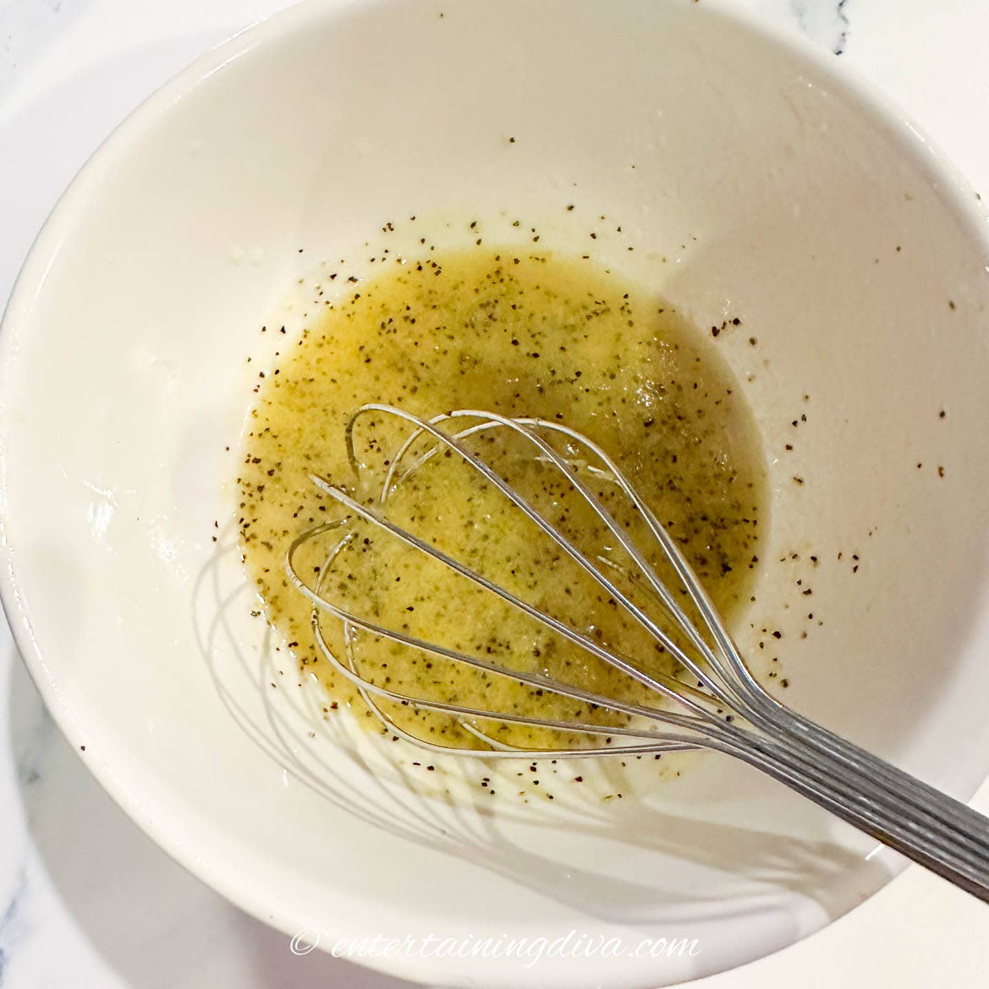 chicken piccata marinade in a bowl