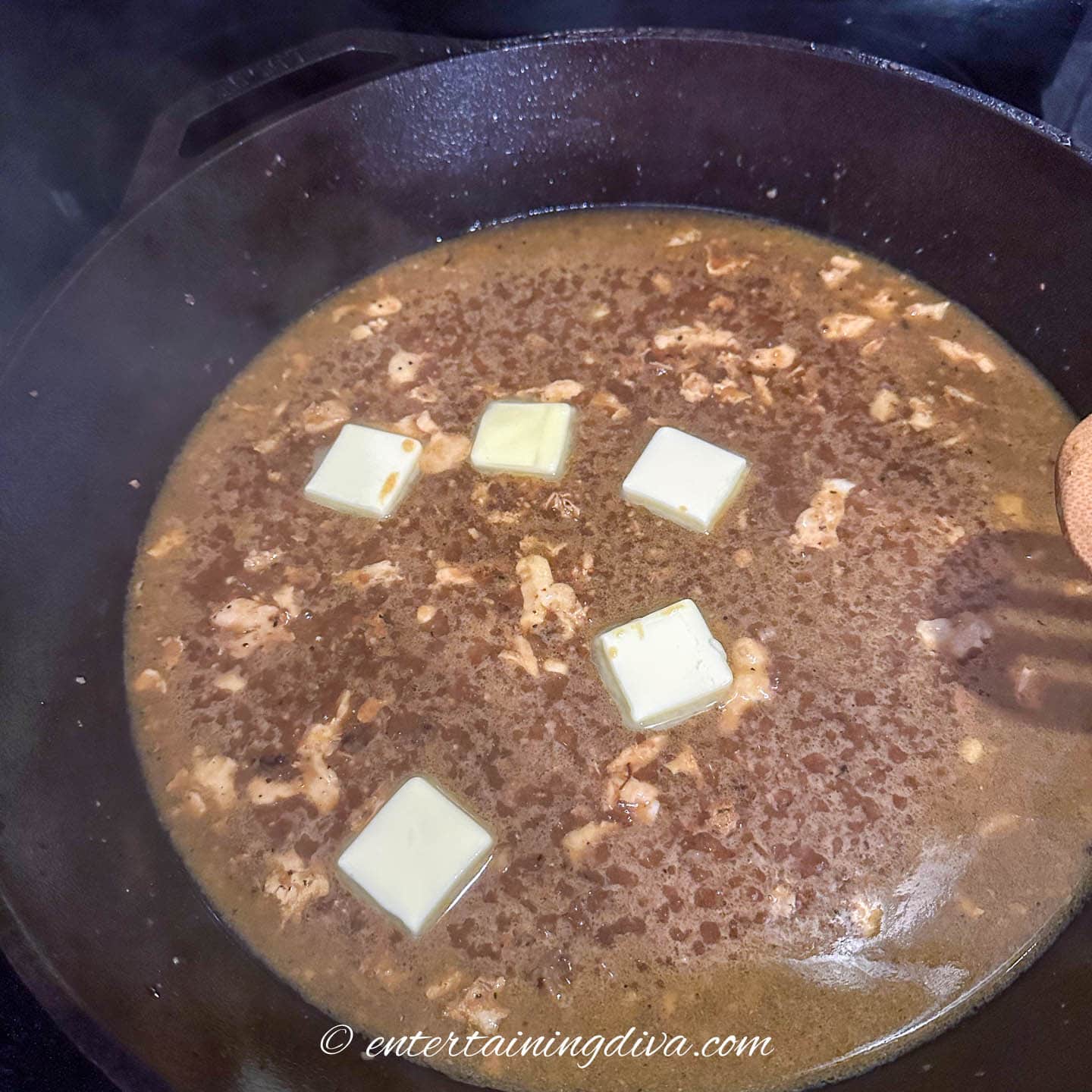 pieces of butter melting in a piccata sauce