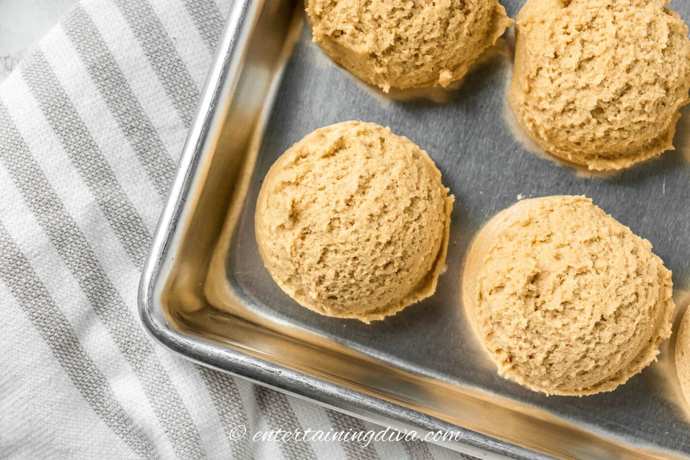 Peanut butter cookie dough on a cookie sheet