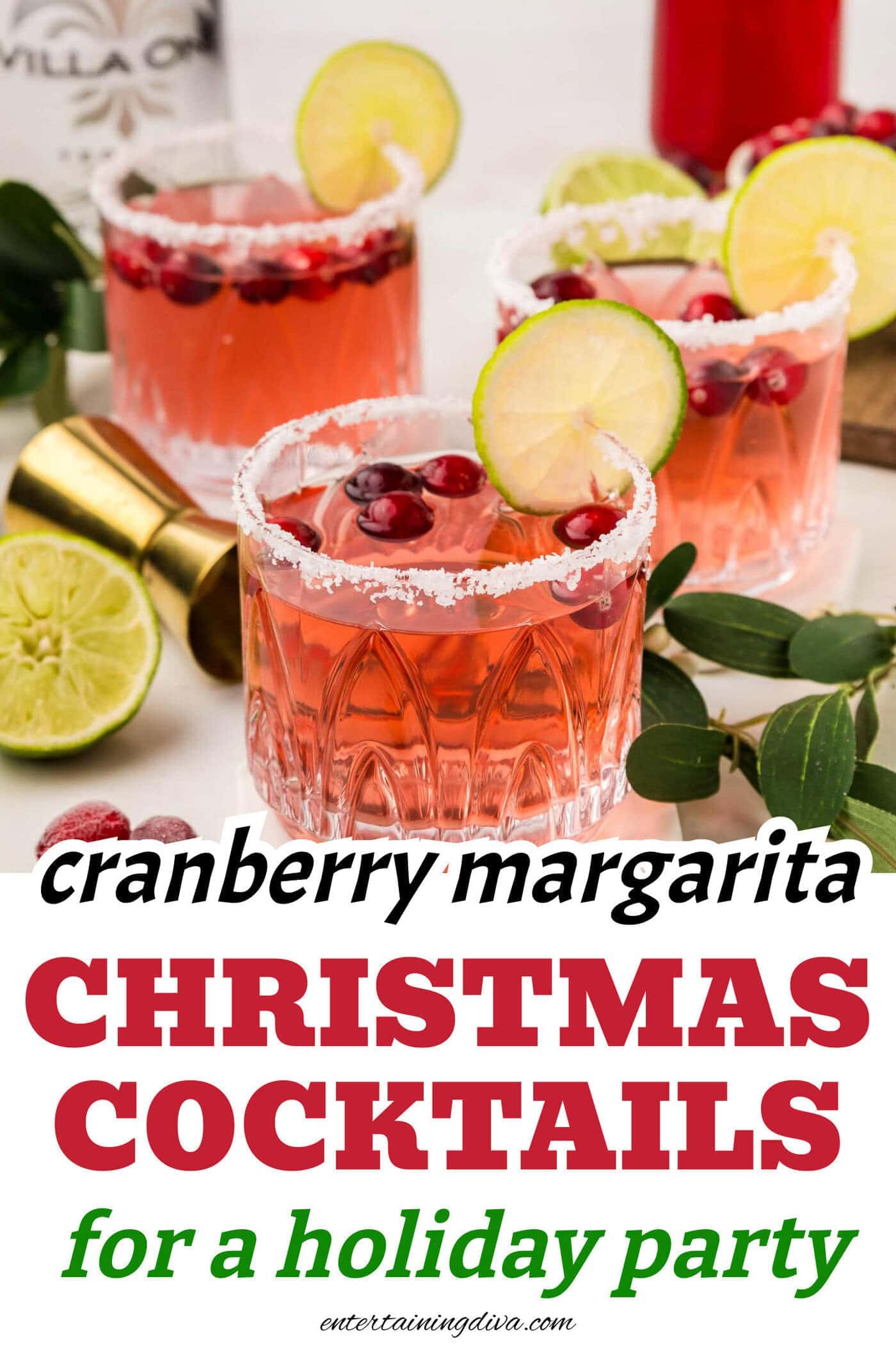 close up of a cranberry margarita garnished with a salt rim, fresh cranberries and a lime wheel