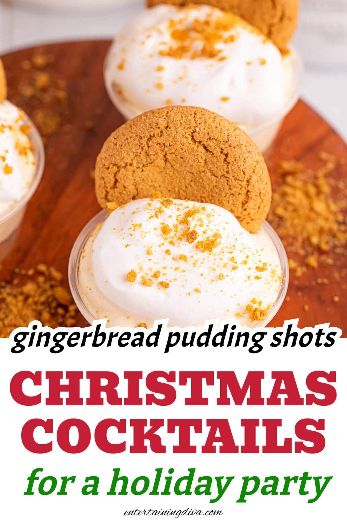 Gingerbread Christmas pudding shots garnished with whipped cream, cookie crumbs and a ginger snap cookie