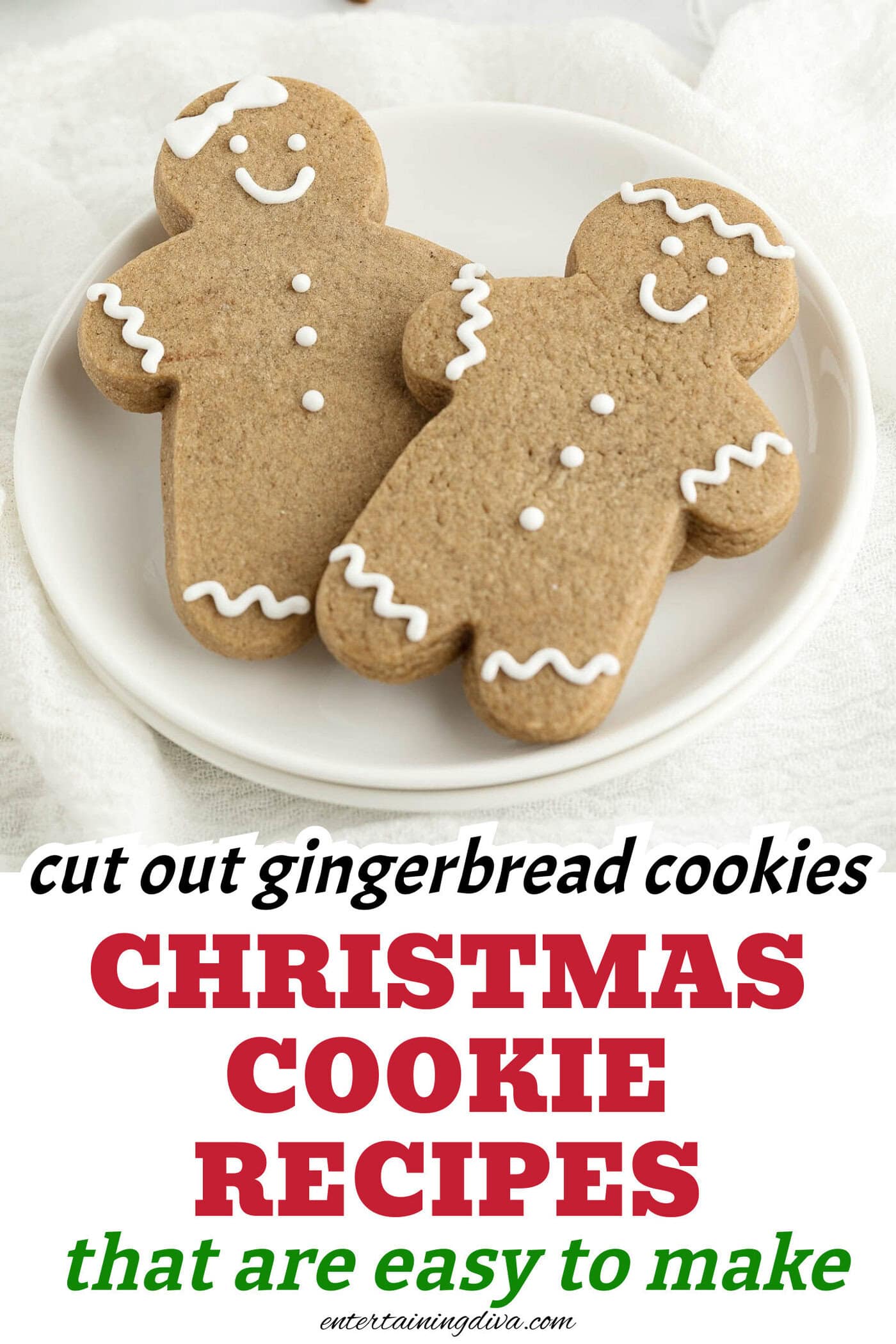 a close up of two gingerbread men on a plate beside some cinnamon sticks and a second plate with gingerbread cookies in the shape of snowflakes