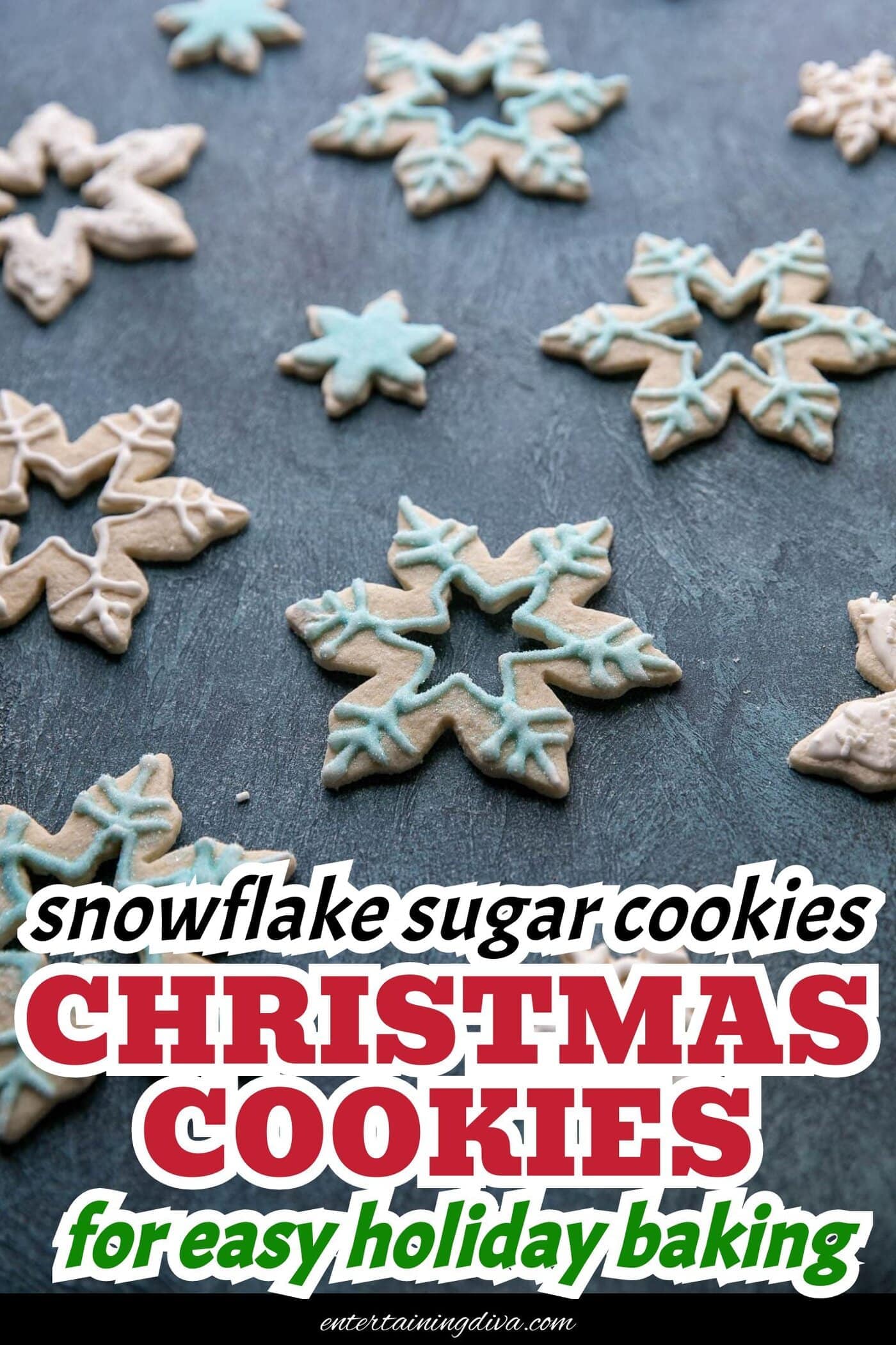 snowflake sugar cookies decorated with white royal icing and blue sprinkles
