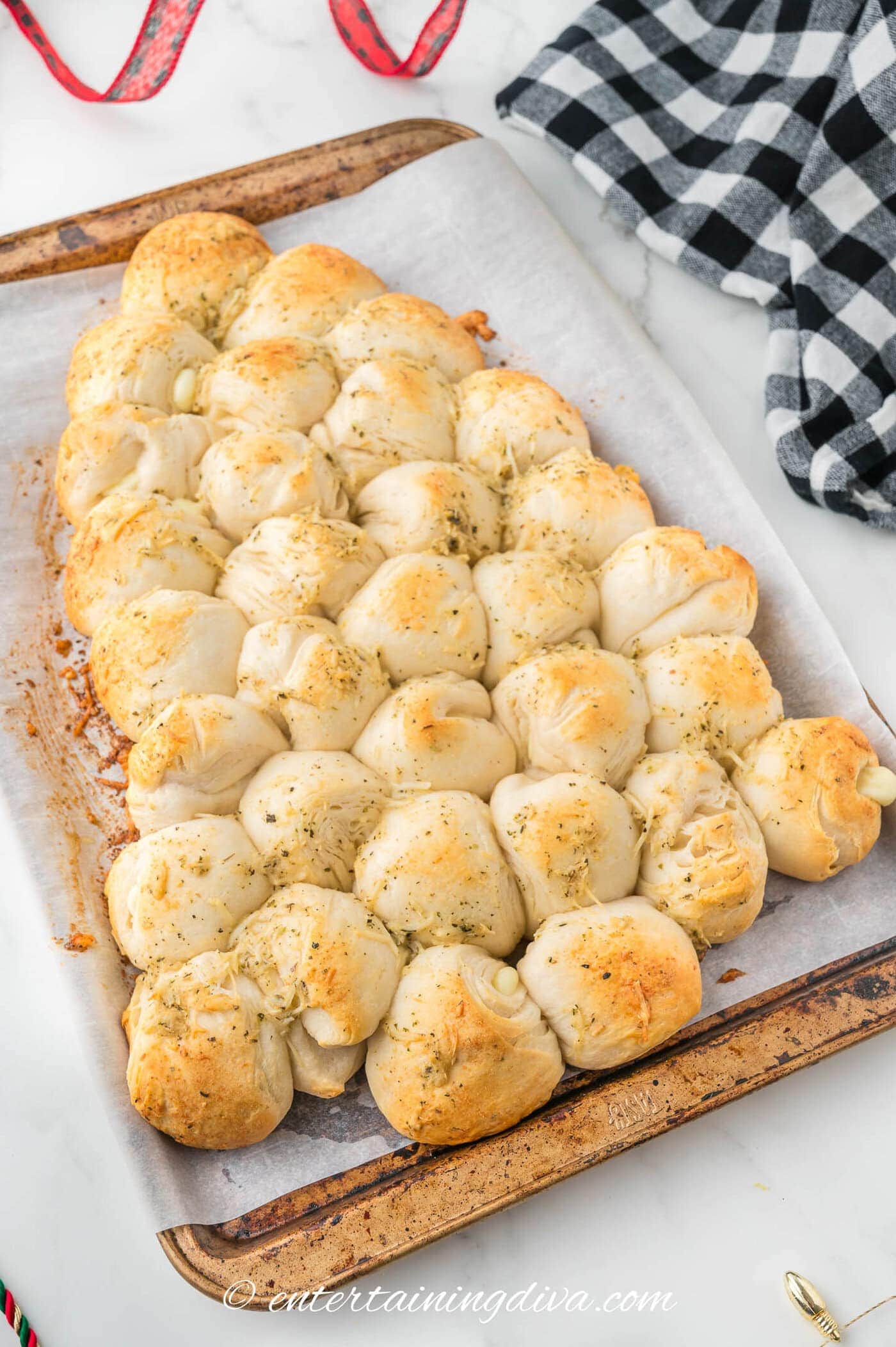 cheesy and garlicky Christmas tree pull apart bread on a baking sheet after baking