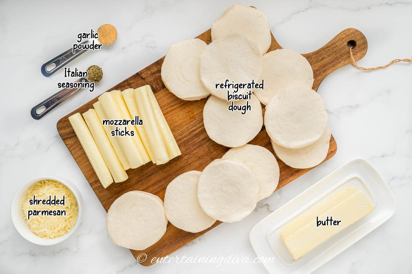 Christmas tree pull apart bread ingredients - refrigerated biscuits, butter, mozzarella sticks, garlic powder, Italian seasoning, shredded partmesan