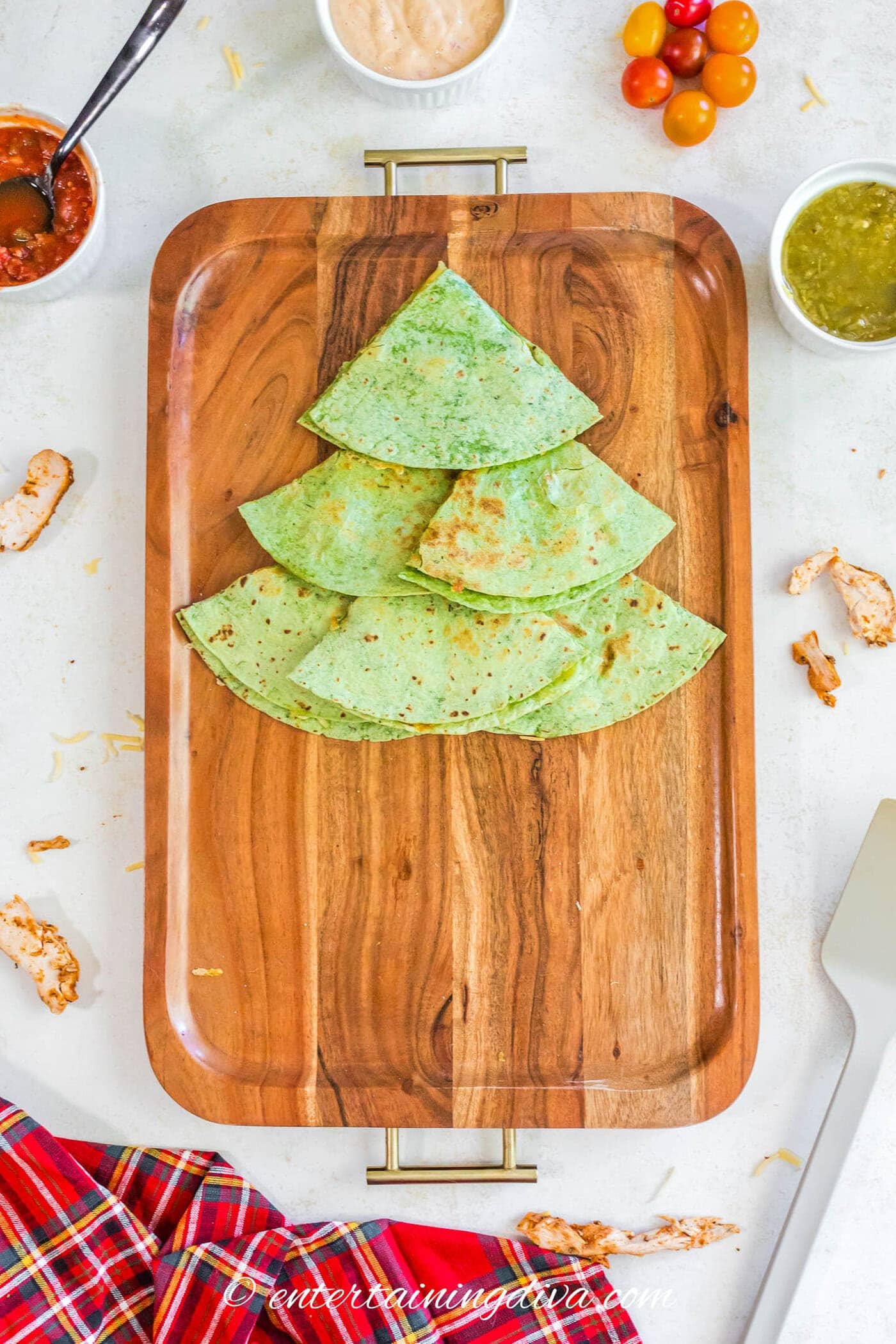 Three layers of quesadillas forming a Christmas tree shape.