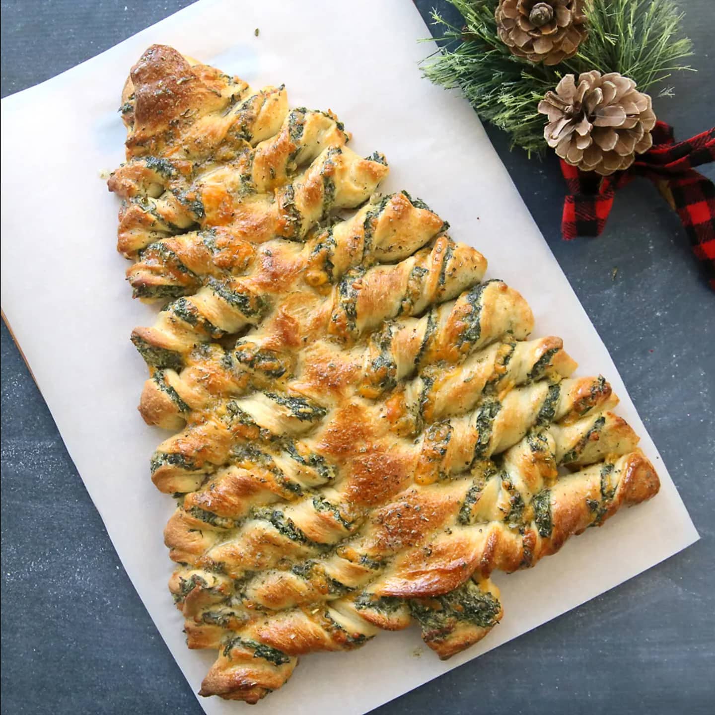 A christmas tree braided bread on a baking sheet.