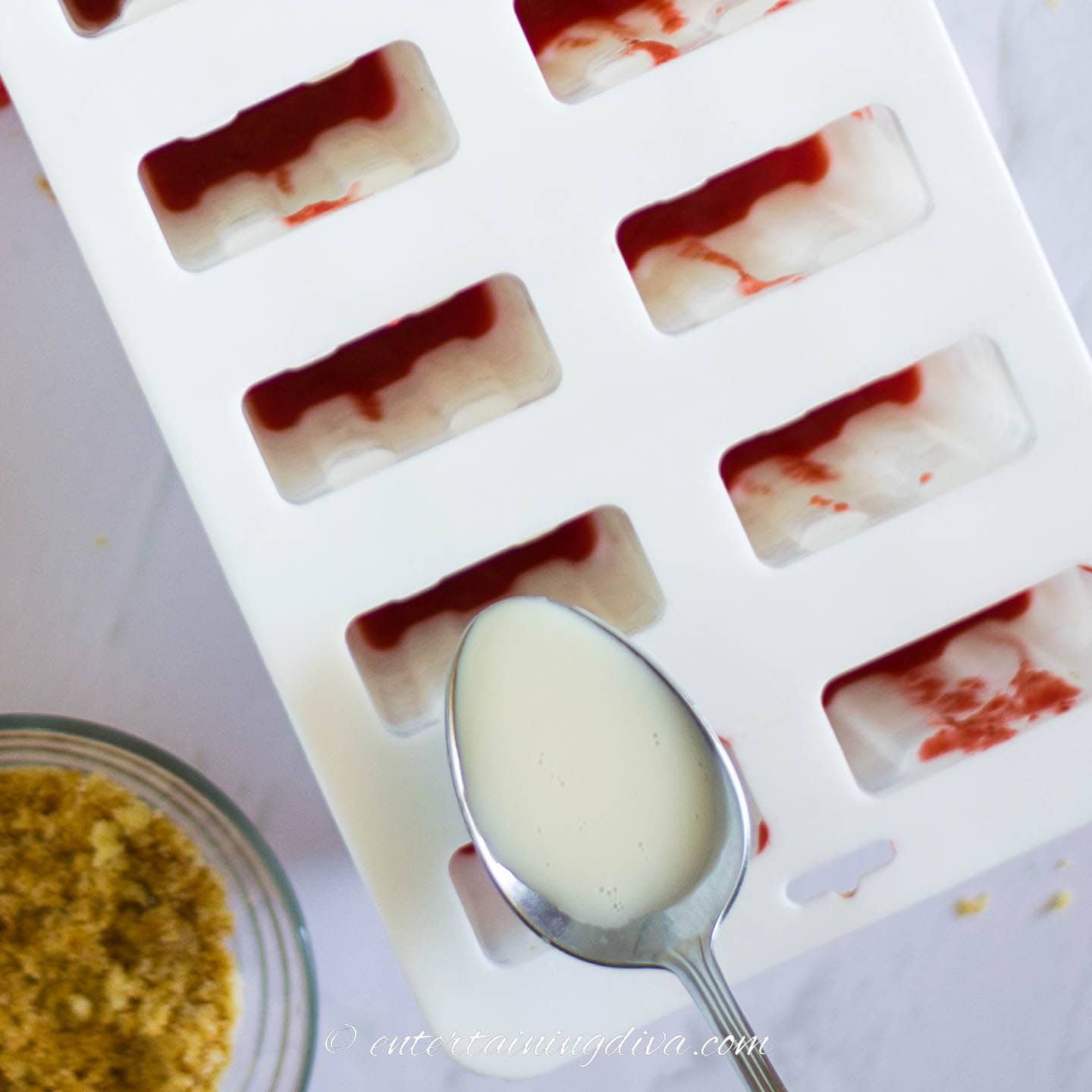 coconut milk being added to popsicle mold