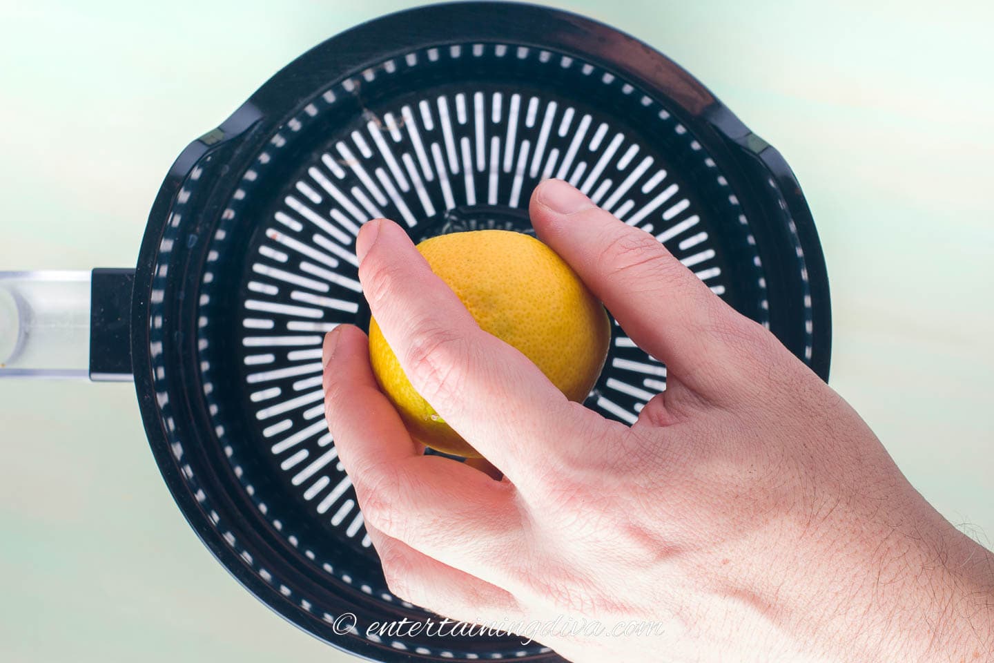 Lemon being juiced