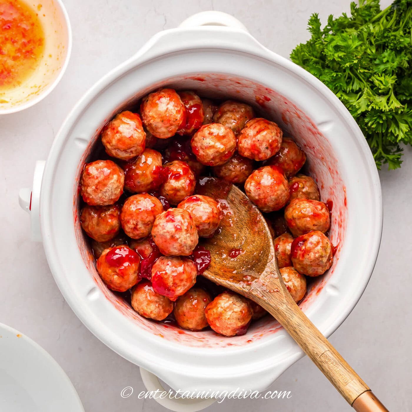 turkey meatballs coated with cranberry and chili sauce in a crock pot