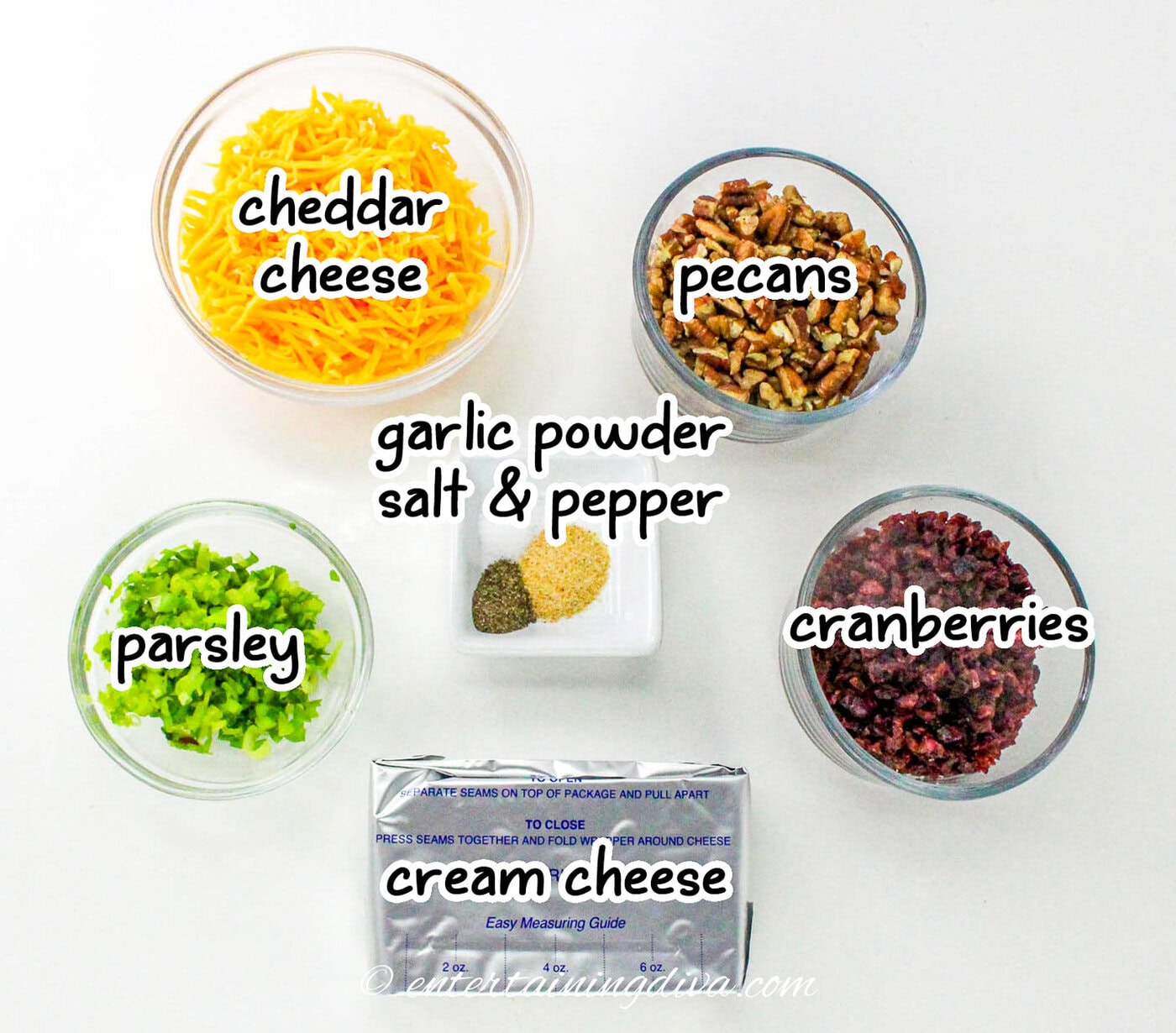 cranberry pecan cheese ball ingredients - cheddar cheese, cream cheese, pecans, cranberries, parsley, garlic powder, salt and pepper