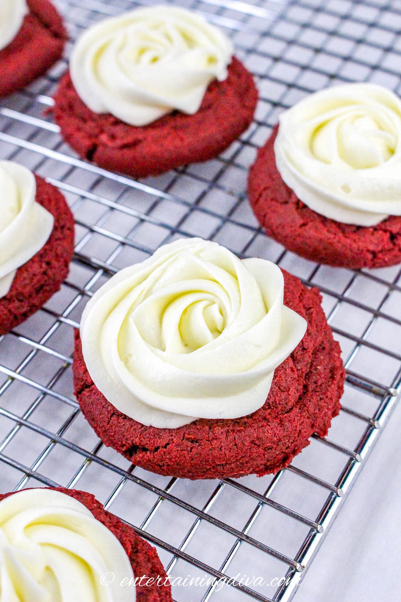Cream cheese frosting on red velvet cookies