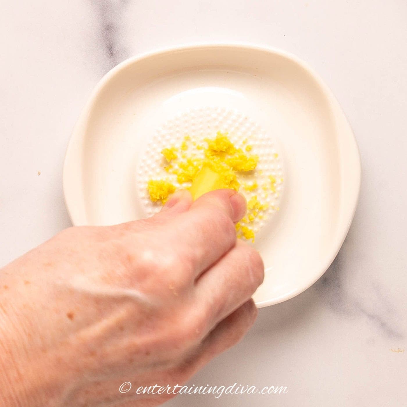 fresh ginger being grated