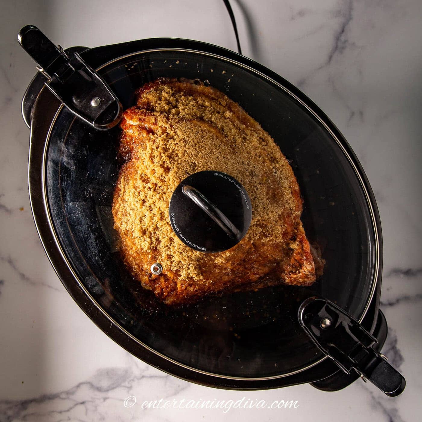 a spiral ham in a crock pot with the lid on