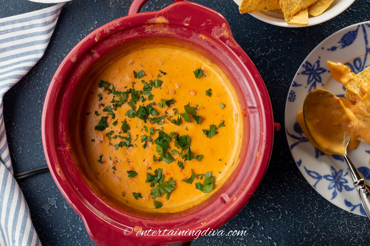 Crockpot Velveeta Rotel cheese dip with cilantro on top