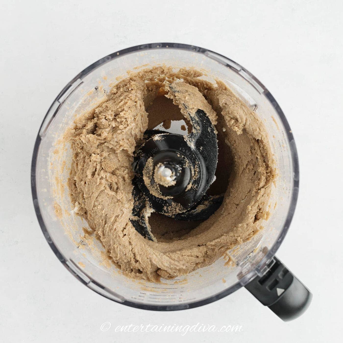 butter and sugar mixed in a food processor