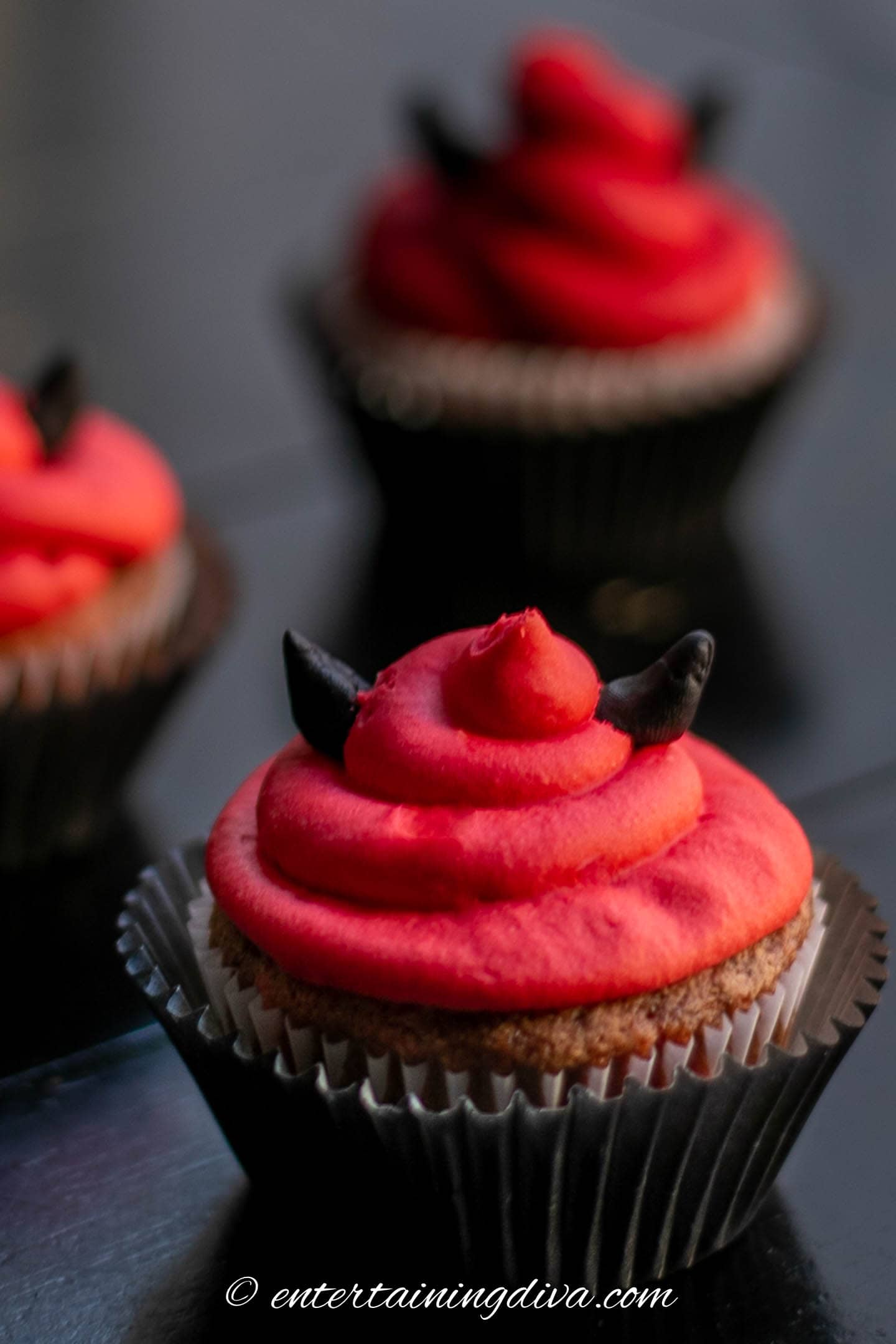 Close up of a red velvet Halloween cupcake