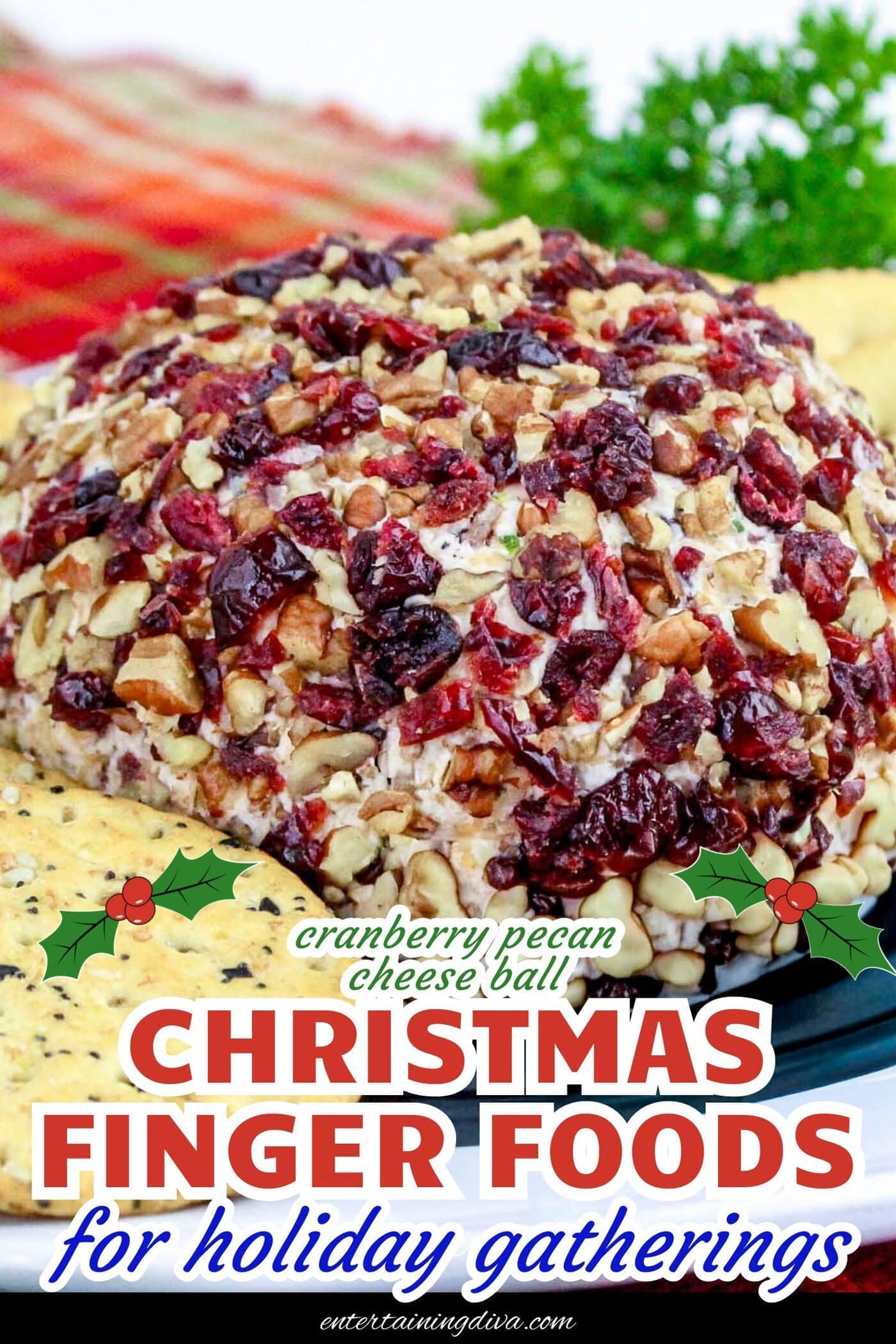 cranberry pecan cheese ball on a plate with crackers