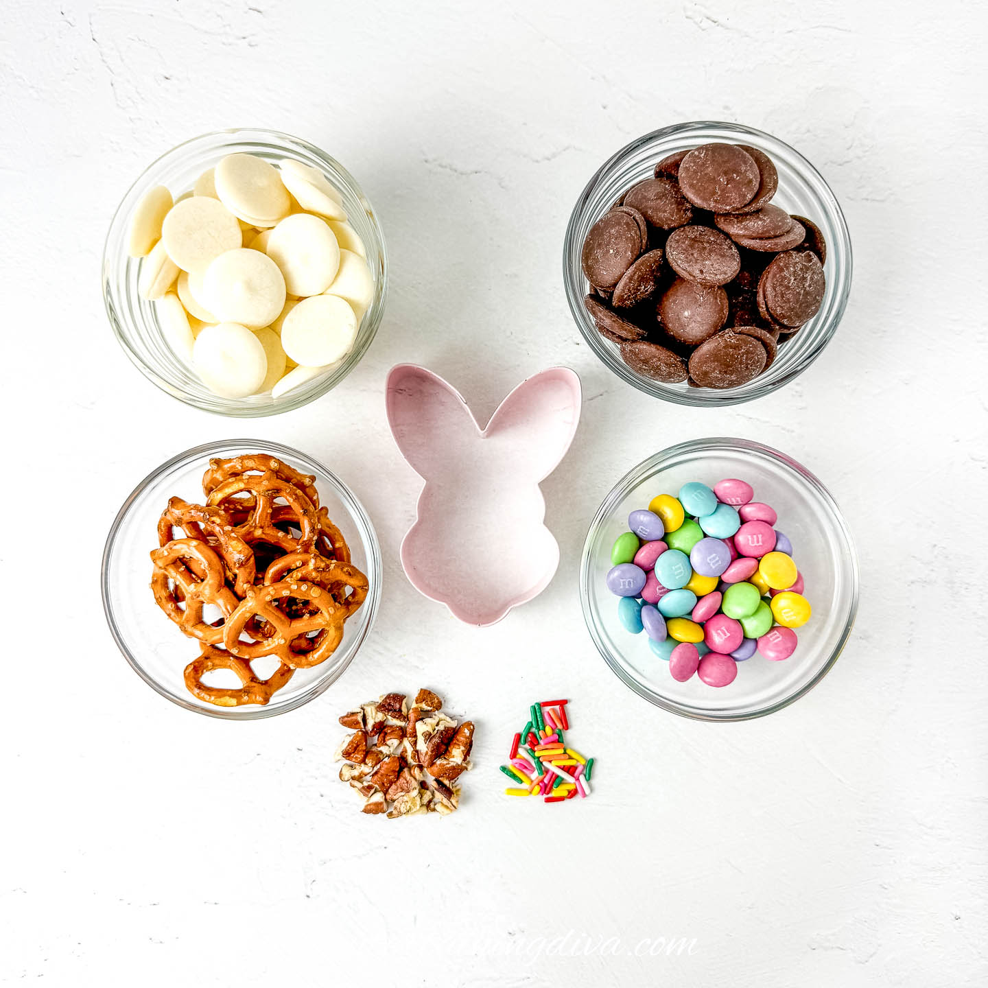 chocolate bunny easter bark ingredients - white and milk chocolate candy melts, pretzels, pecans, M&M's and sprinkles