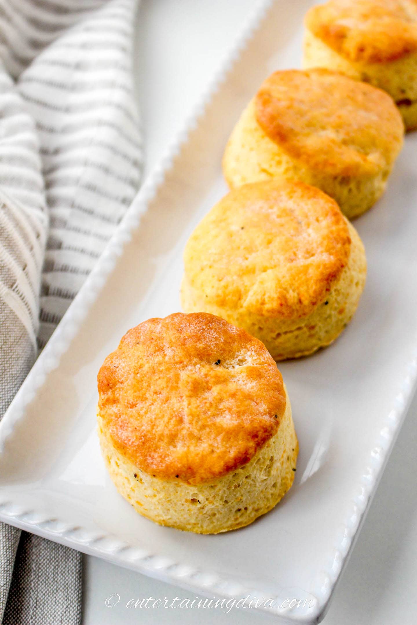 Cheesy biscuits on a white tray