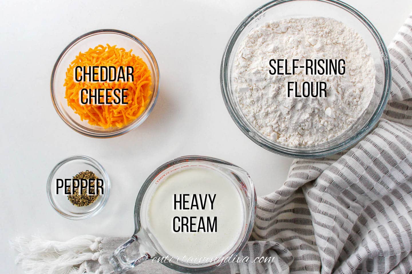 easy cheddar cheese biscuits ingredients - self rising flour, cheddar cheese, black pepper, heavy cream