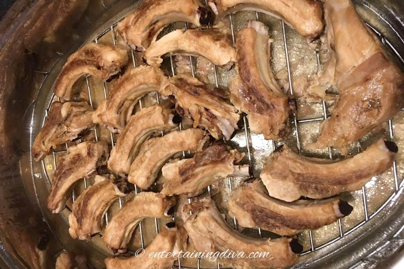 ribs on a wire rack in a baking pan