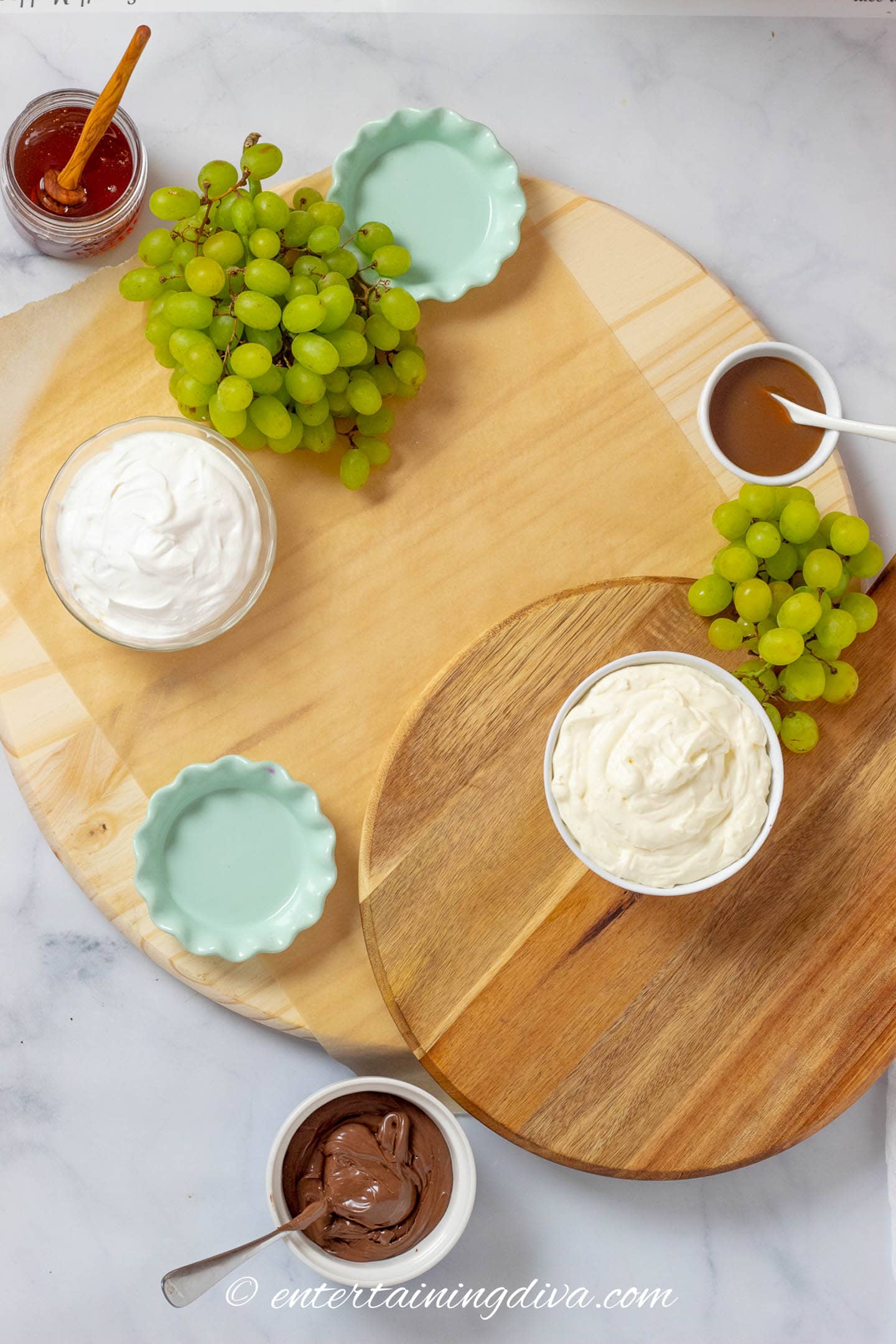 charcuterie board with grapes and dips