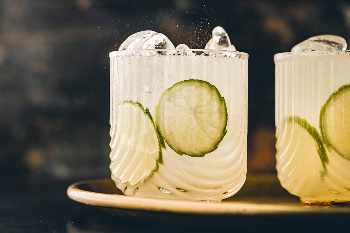 Two gin rickey cocktails on a tray