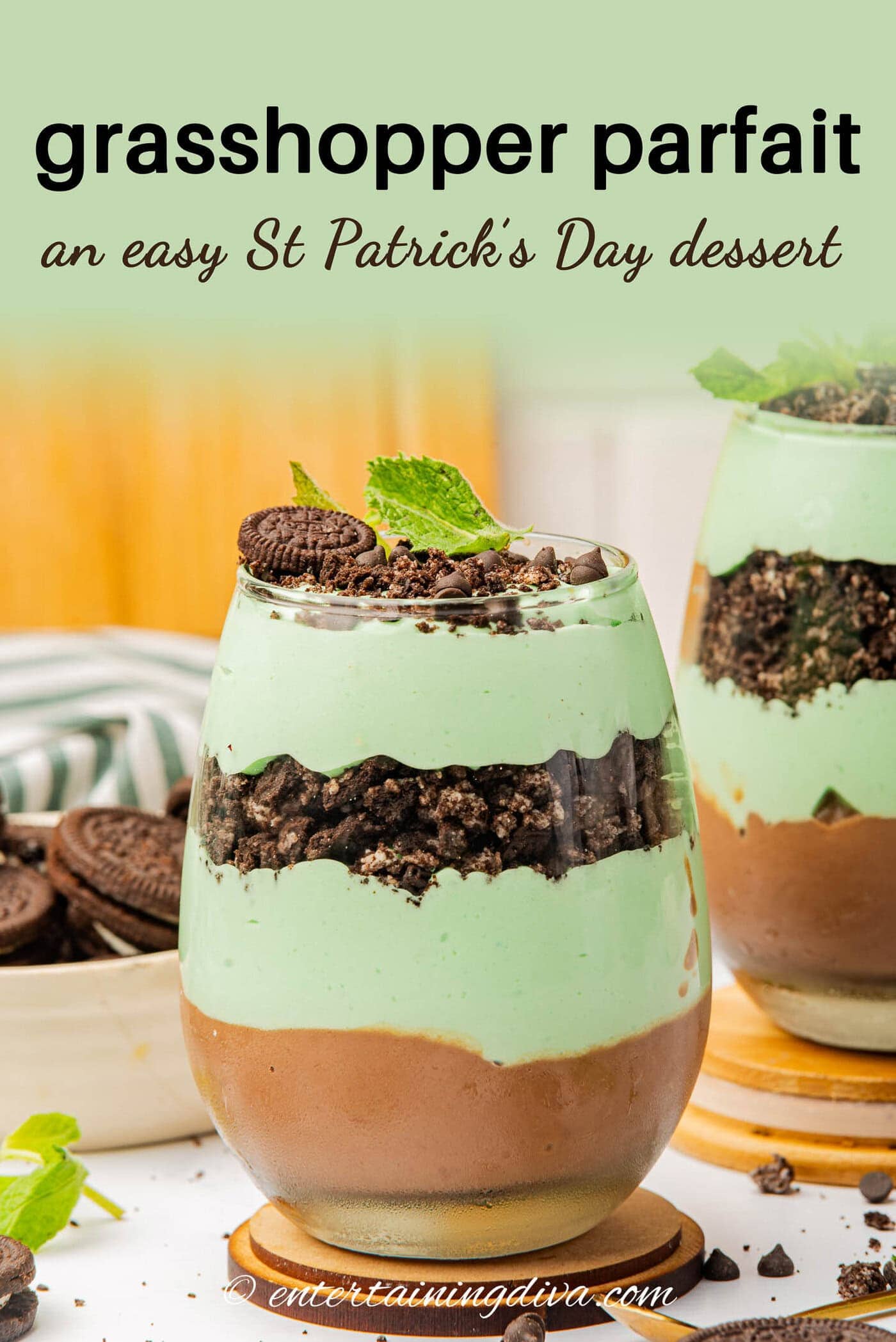 a side view grasshopper parfait with green Cool Whip, chocolate pudding and Oreo cookie layers