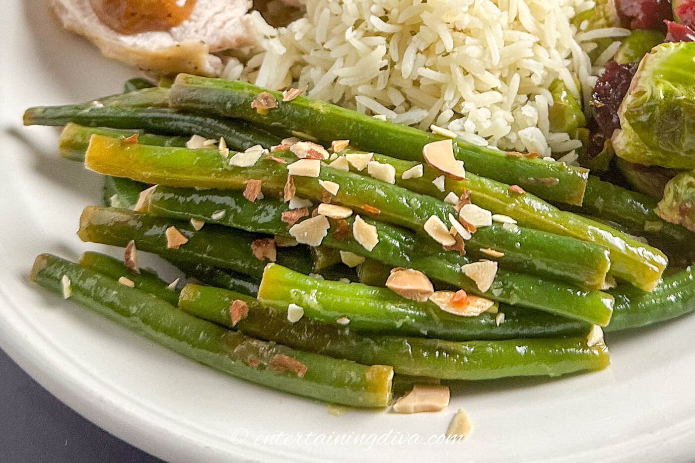 close up of green beans almondine on a plate
