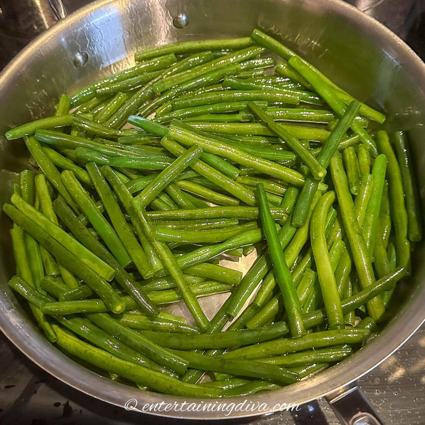 Green beans in a sauce pan with water