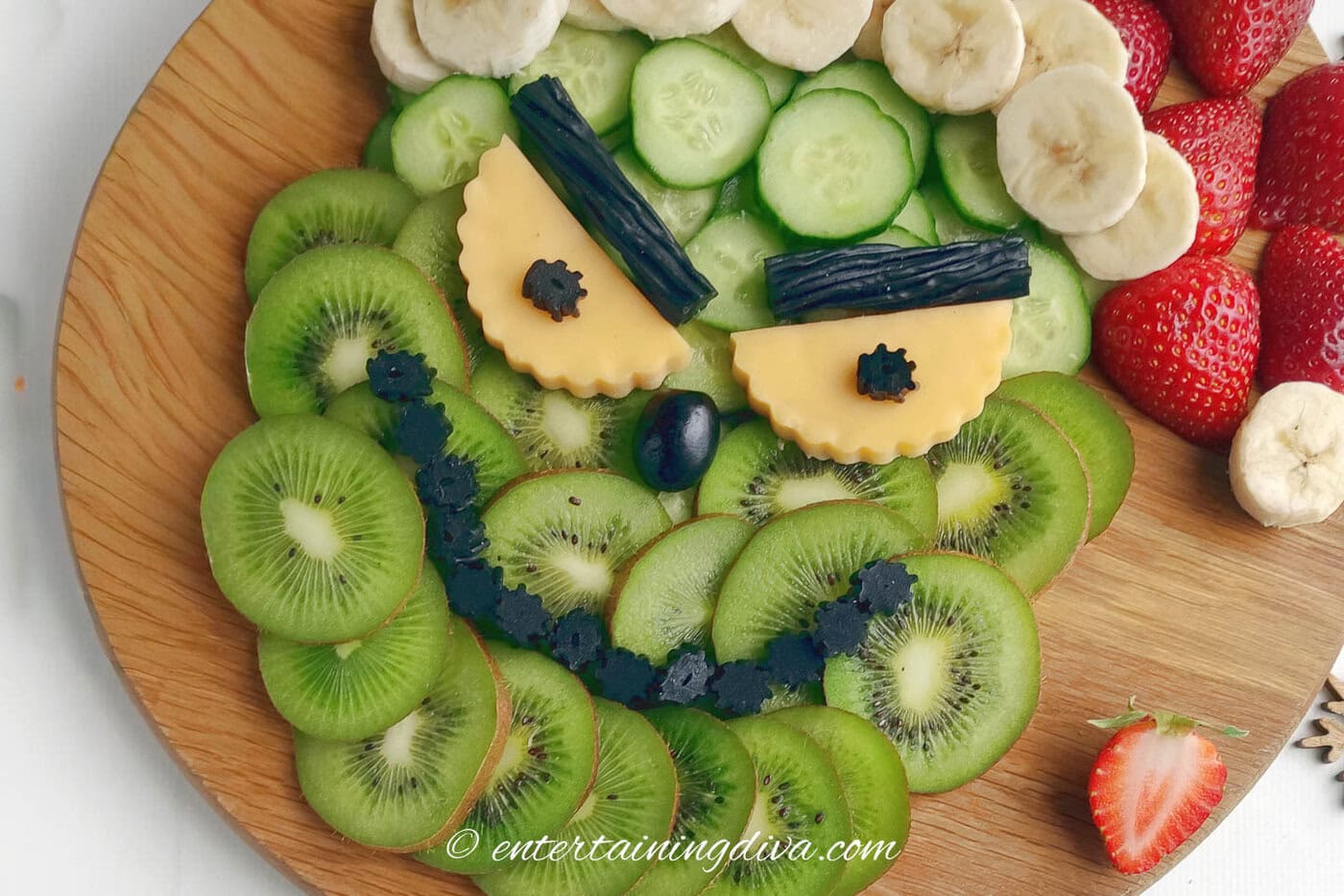 grinch Charctuerie board on a wood cutting board