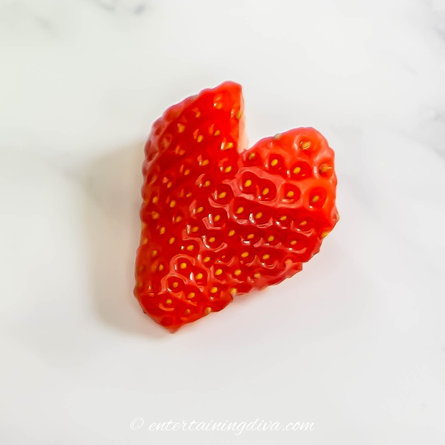 A strawberry cut into a strawberry shape