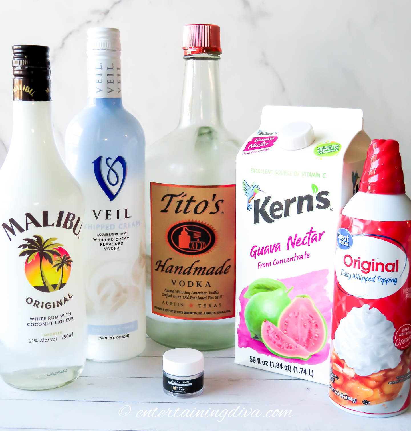 guava martini ingredients - malibu rum, whipped cream vodka, regular vodka, guava nectar and whipped cream