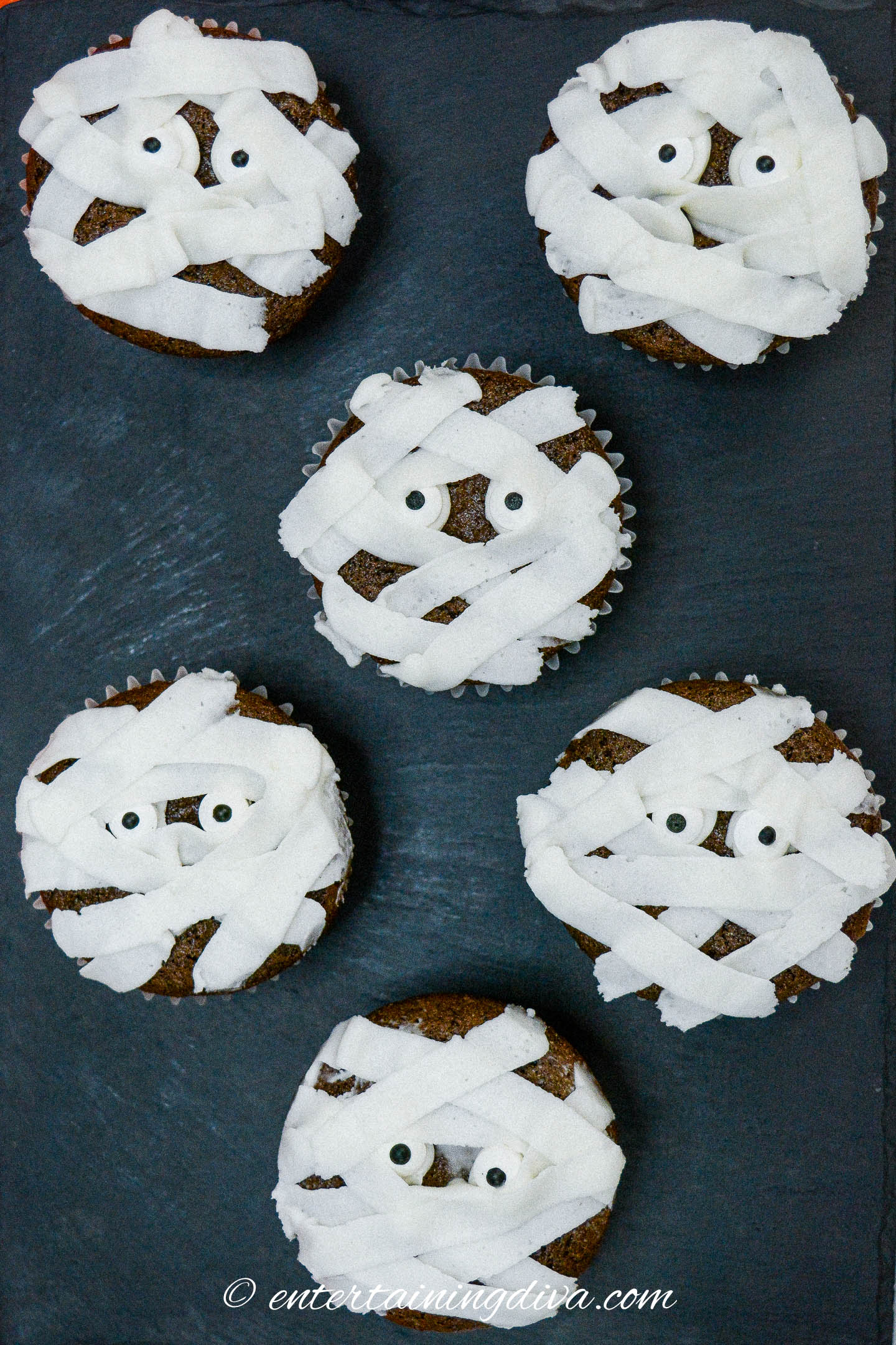 Chocolate Halloween cupcakes decorated like mummies