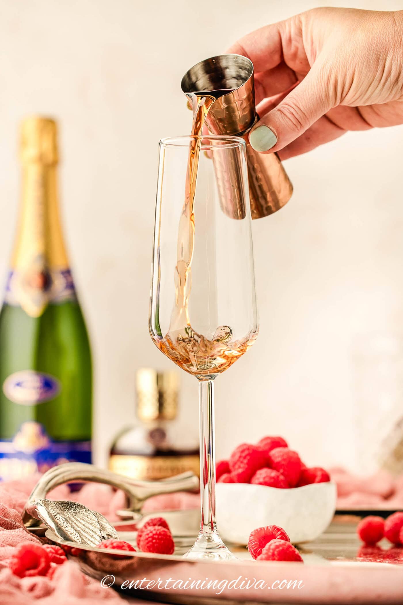 Chambord being poured into a champagne flute