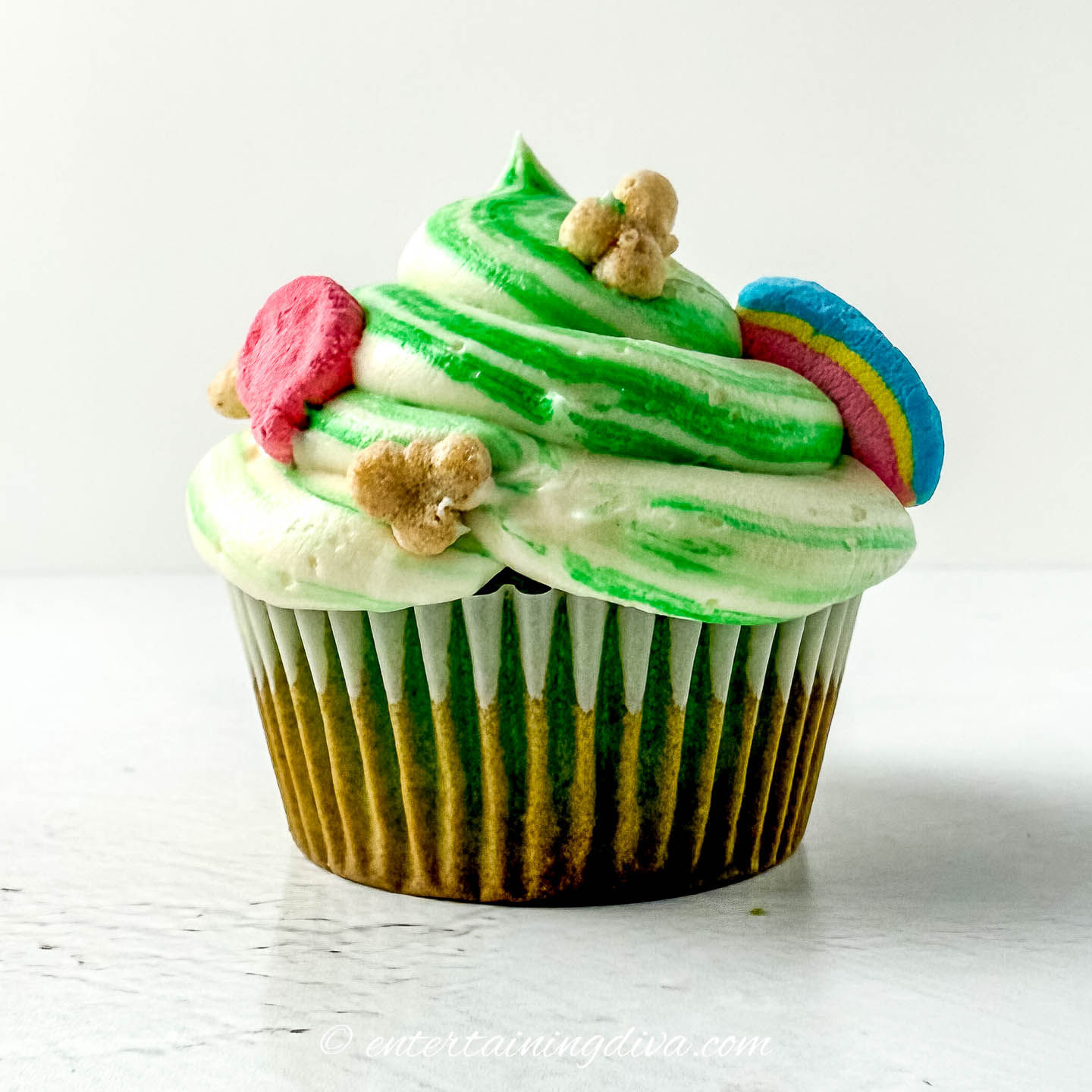 a lucky charms cupcake with marshmallow buttercream frosting