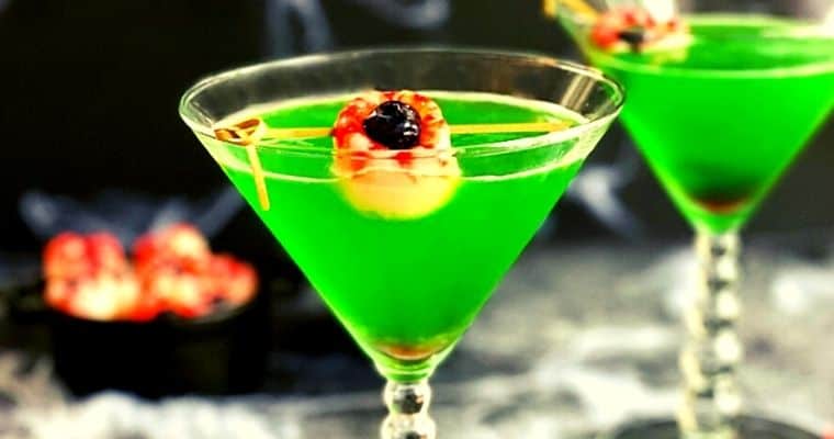 green halloween gin martini with lychee eyeballs