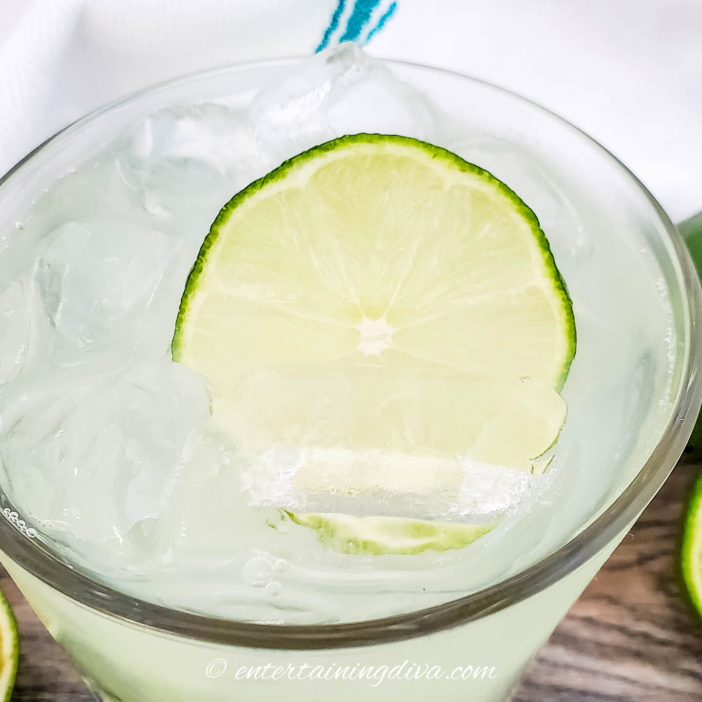Close up of a lime wheel garnish in a margarita