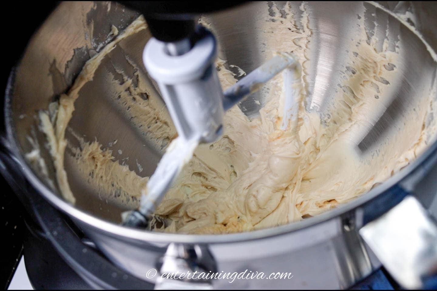 beating butter in an electric mixer
