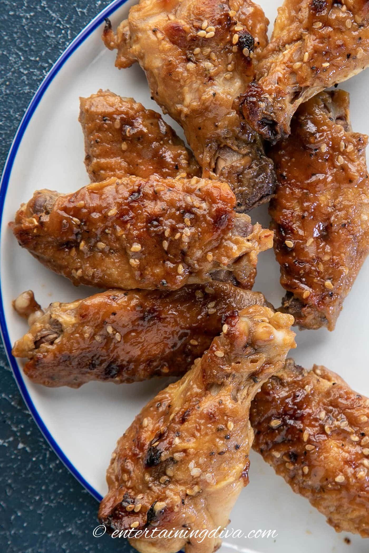 overhead view of oyster sauce baked chicken wings on a plate
